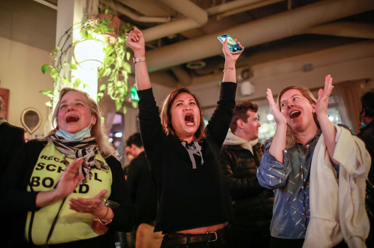 Women cheer as they celebrate at the pro-recall party at Manny's restaurant on Tuesday, Feb. 15, 2022