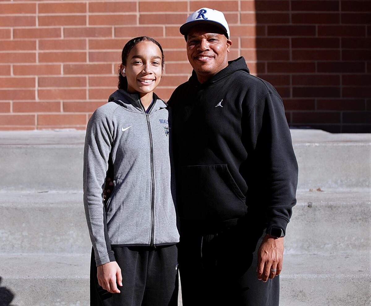 Rialto High junior guard Carrington Davis poses for a photo with her father, Tyrell Parks.
