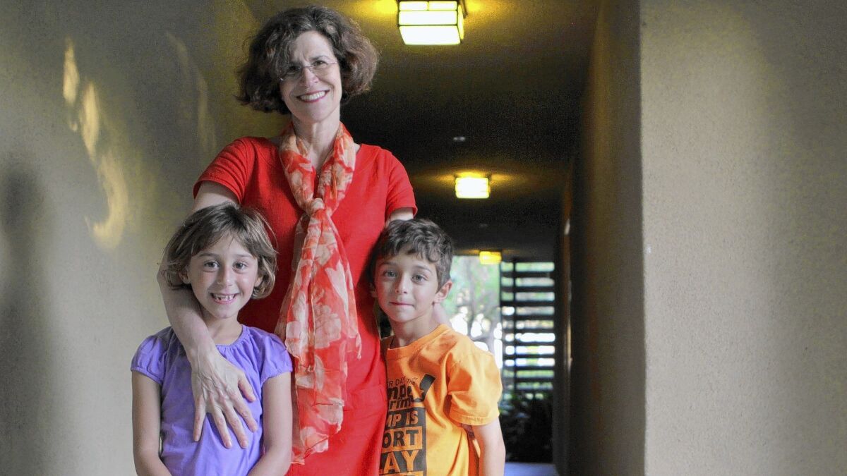 Wendy Wolfson of Irvine, mother of 7-year-old twins, got help with child care through an employee assistance program.
