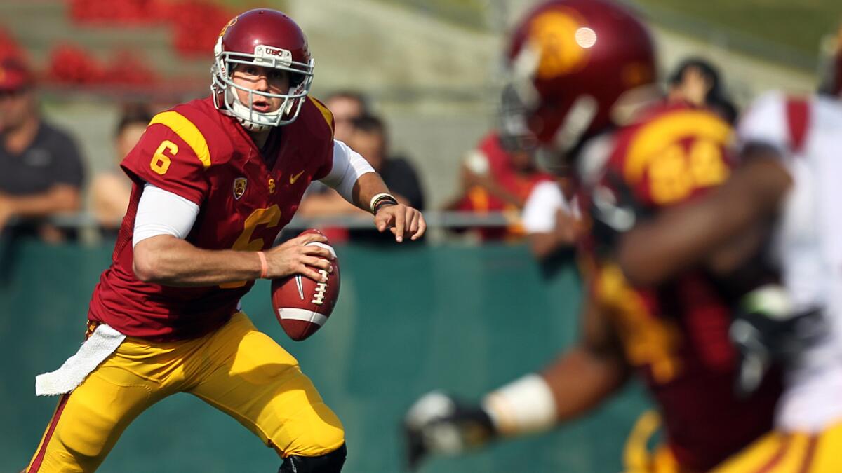 USC quarterback Cody Kessler looks for an open receiver during the Trojans' spring game in April. USC Coach Steve Sarkisian is looking for more speed from the Trojans' no-huddle offense.