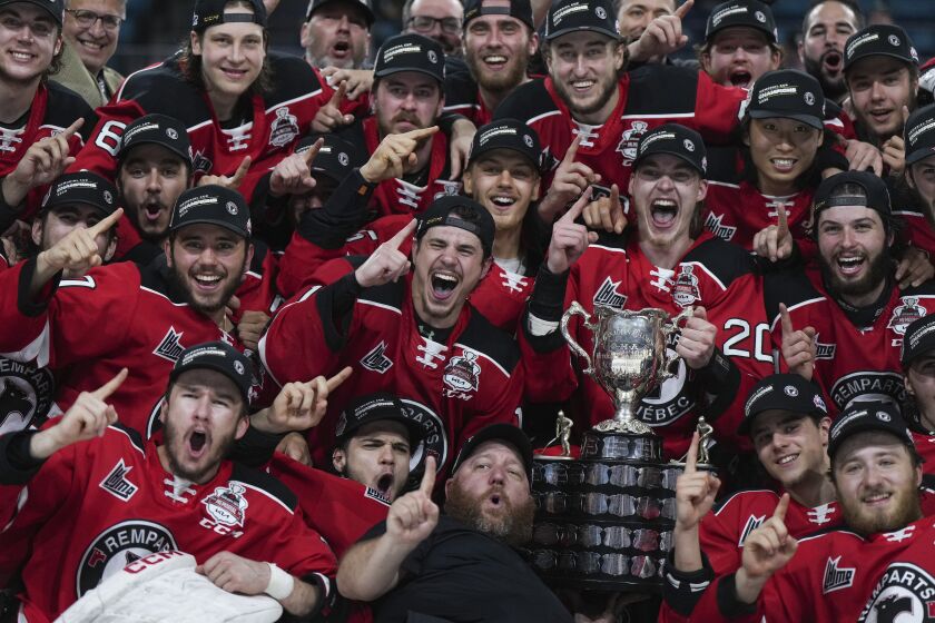 The Quebec Remparts celebrate with the CHL Memorial Cup after Quebec defeated the Seattle Thunderbirds during CHL Memorial Cup final hockey action, Sunday, June 4, 2023, in Kamloops, British Columbia. (Darryl Dyck/The Canadian Press via AP)