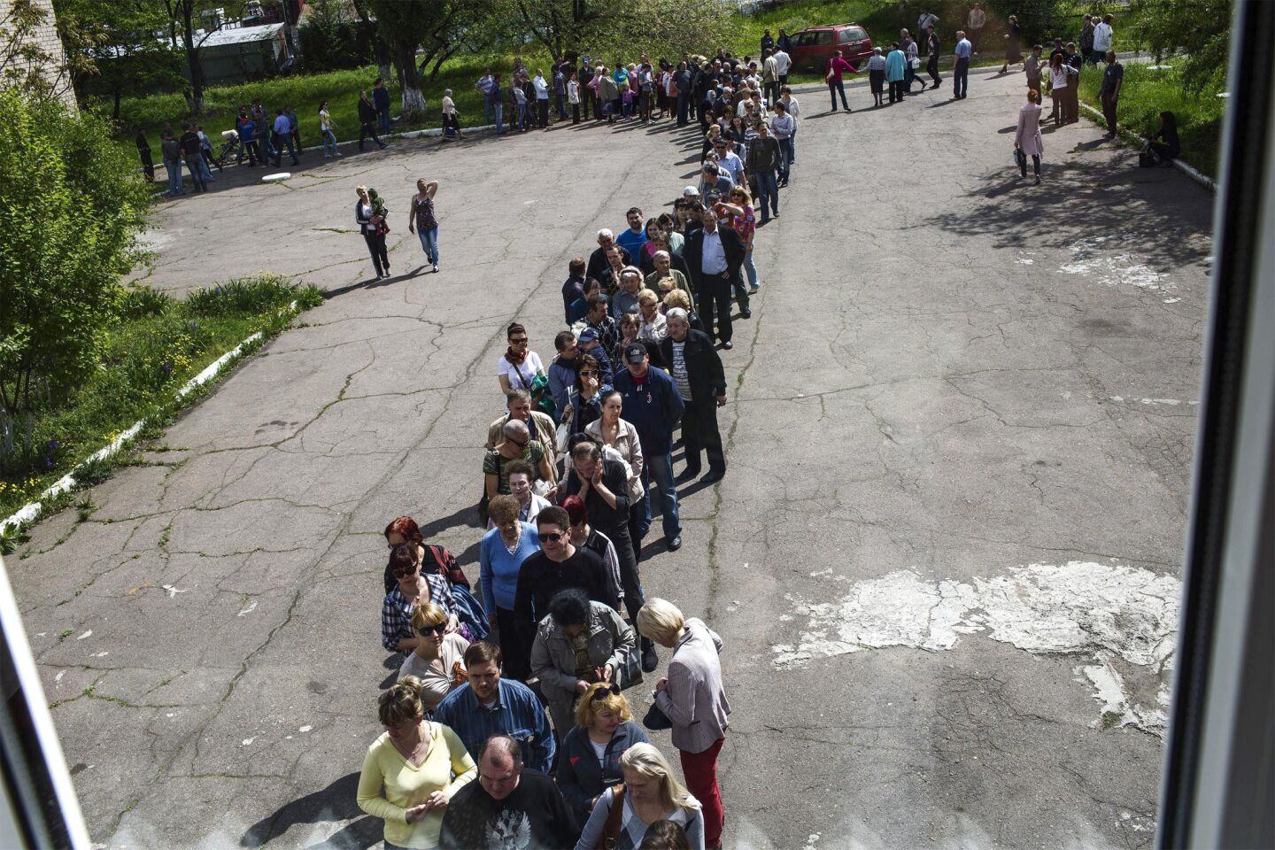 People wait in line in Budennovskiy, Ukraine, to vote in a May 11 referendum conducted by pro-Russian leaders in eastern Ukraine.