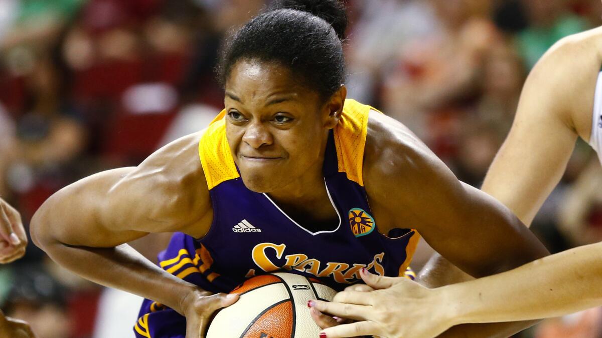 Sparks guard Alana Beard battles to keep possession of the ball during a win over the Seattle Storm on Saturday.