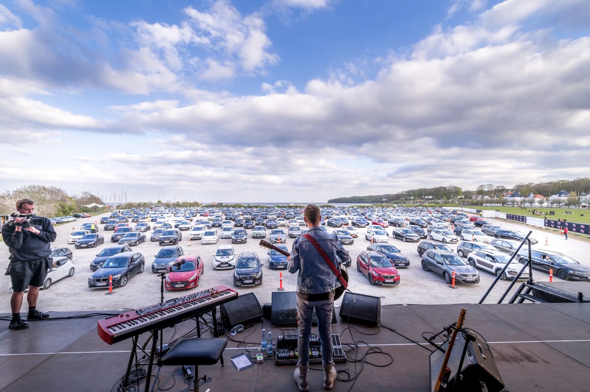 Singer-songwriter Mads Langer is shown performing a drive-in concert in Aarhus, Denmark, on April 24, 2020.