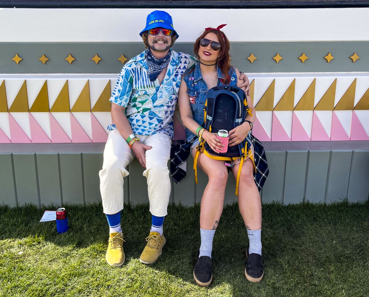 Edd and Molly Benda sitting at Coachella. 