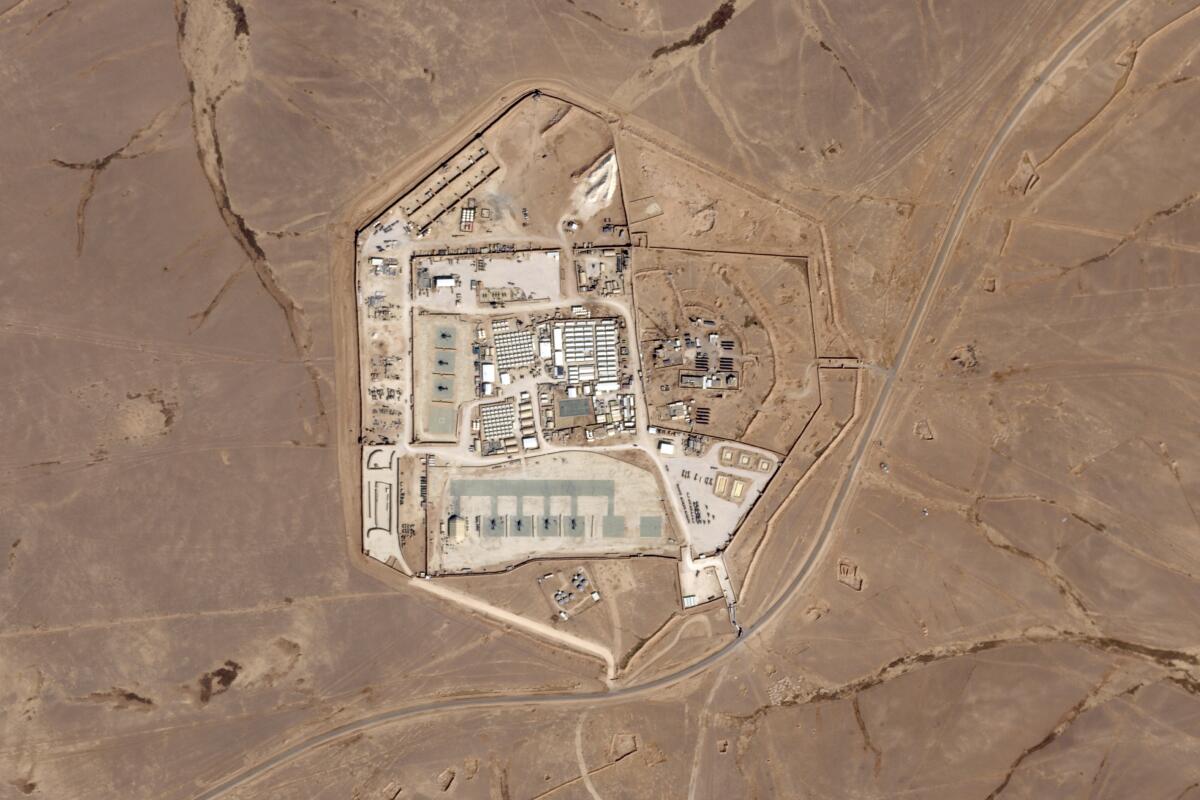 A satellite photo shows a military base surrounded by desert.