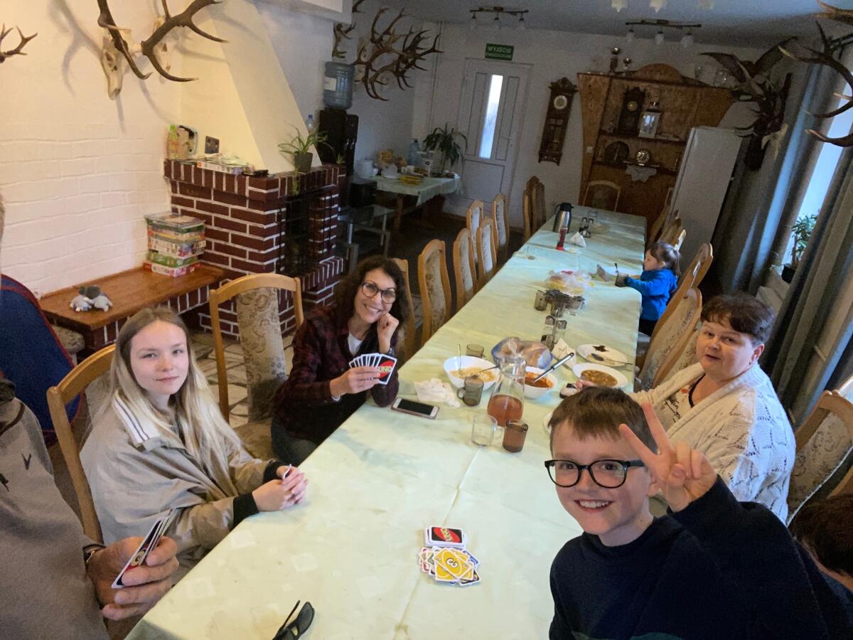 Diane Jones Haney plays Uno with some of the Ukranian refugees.