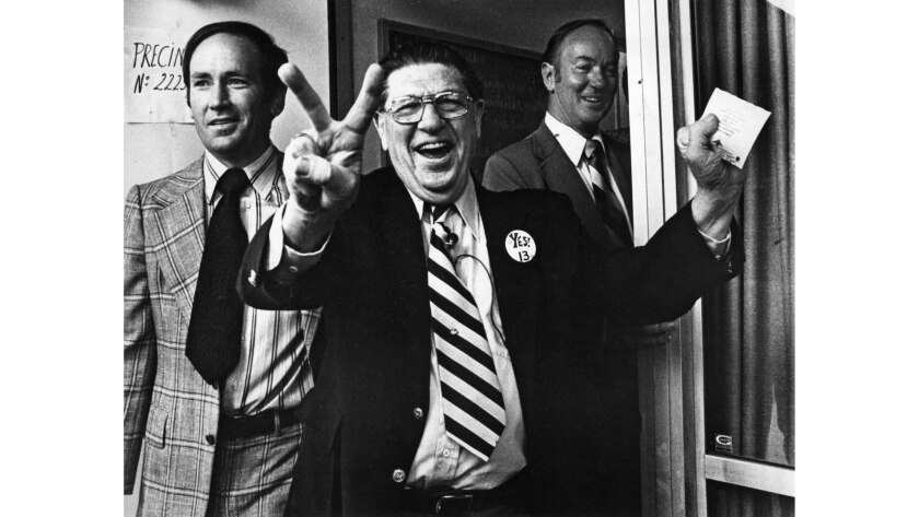 June 6, 1978: Howard Jarvis, anti-tax activist and chief sponsor of the controversial Proposition 13, signals victory as he casts his vote at the Fairfax-Melrose precinct in Los Angeles.