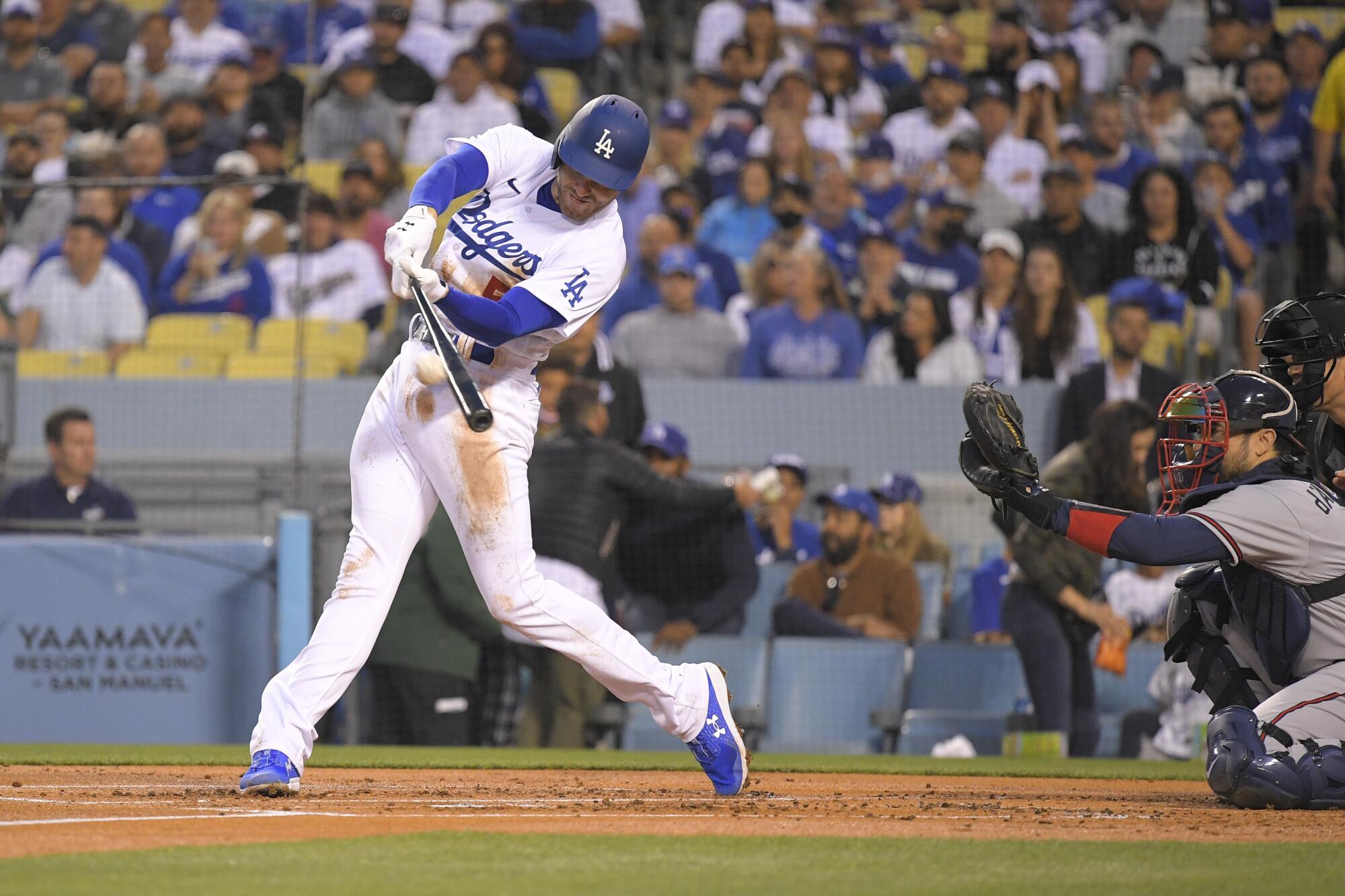 Freddie Freeman hits a home run for the Dodgers against the Atlanta Braves.