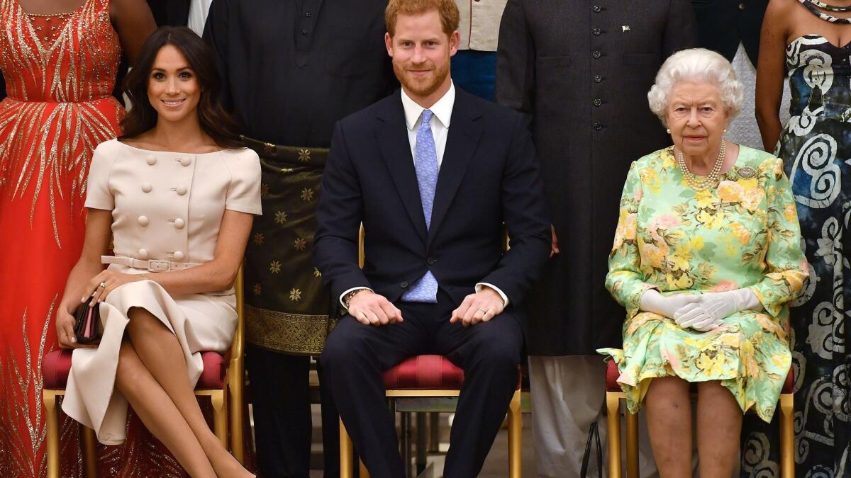 American-born Meghan Markle, now the Duchess of Sussex, was criticized for crossing her legs, a violation of royal protocol, at the Queen Elizabeth's Young Leaders Awards Ceremony June 26 at Buckingham Palace.