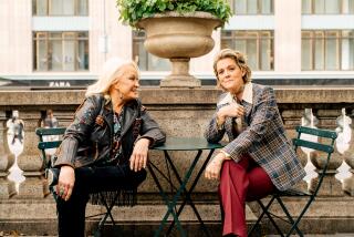 New York, NY - October 19, 2022: Tanya Tucker, left, and Brandi Carlile sitting at a table outside of the New York City Public Library in Manhattan. (Clark Hodgin / For the Times)