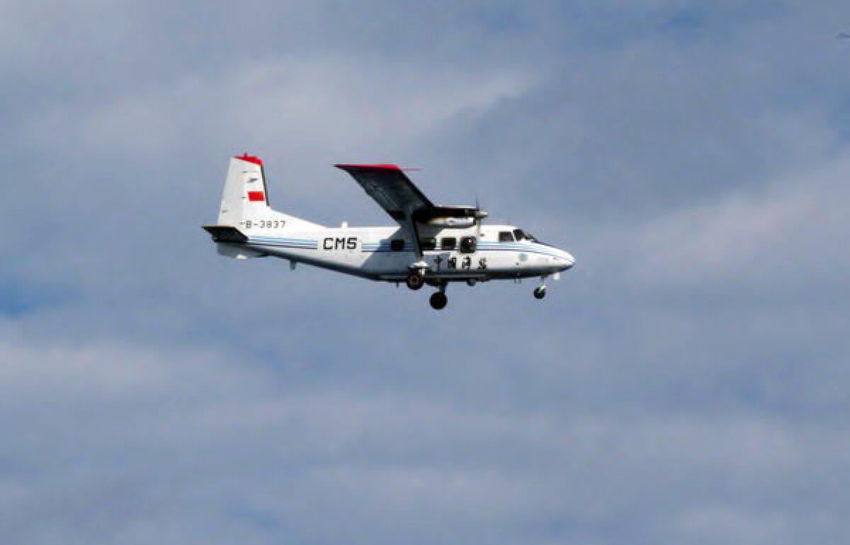 A Chinese airplane flies above the disputed islands known as Senkaku in Japanese and Diaoyu in Chinese.