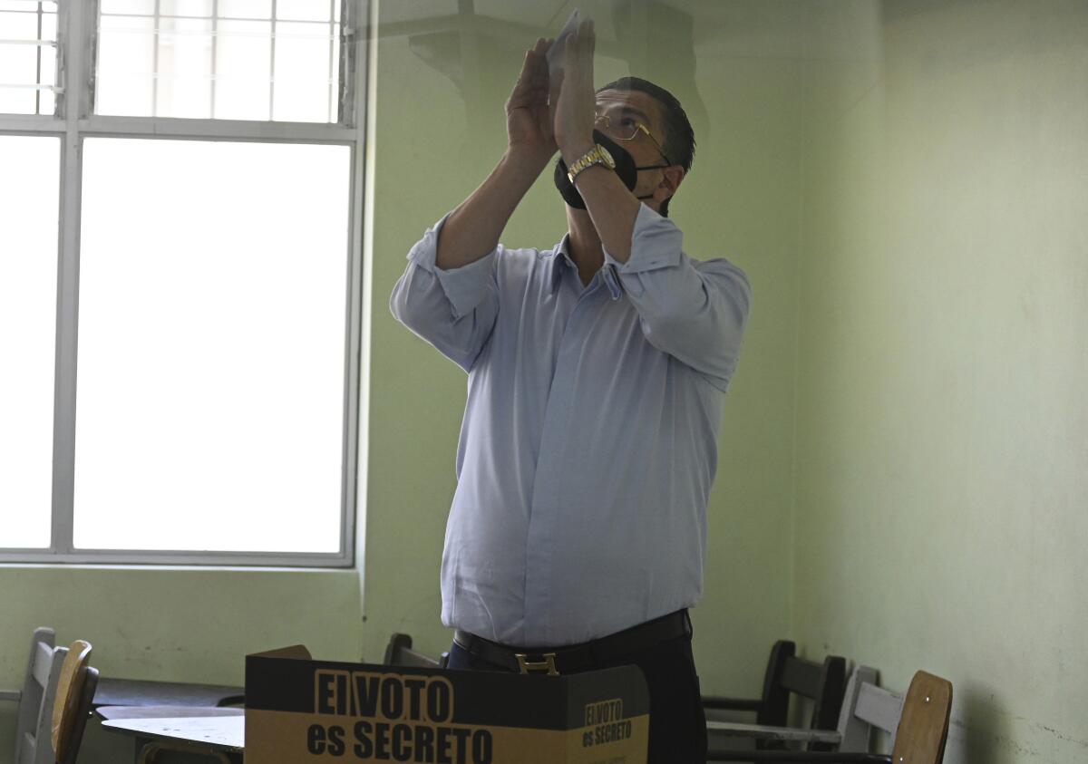 Costa Rican presidential candidate Rodrigo Chaves making prayerful gesture