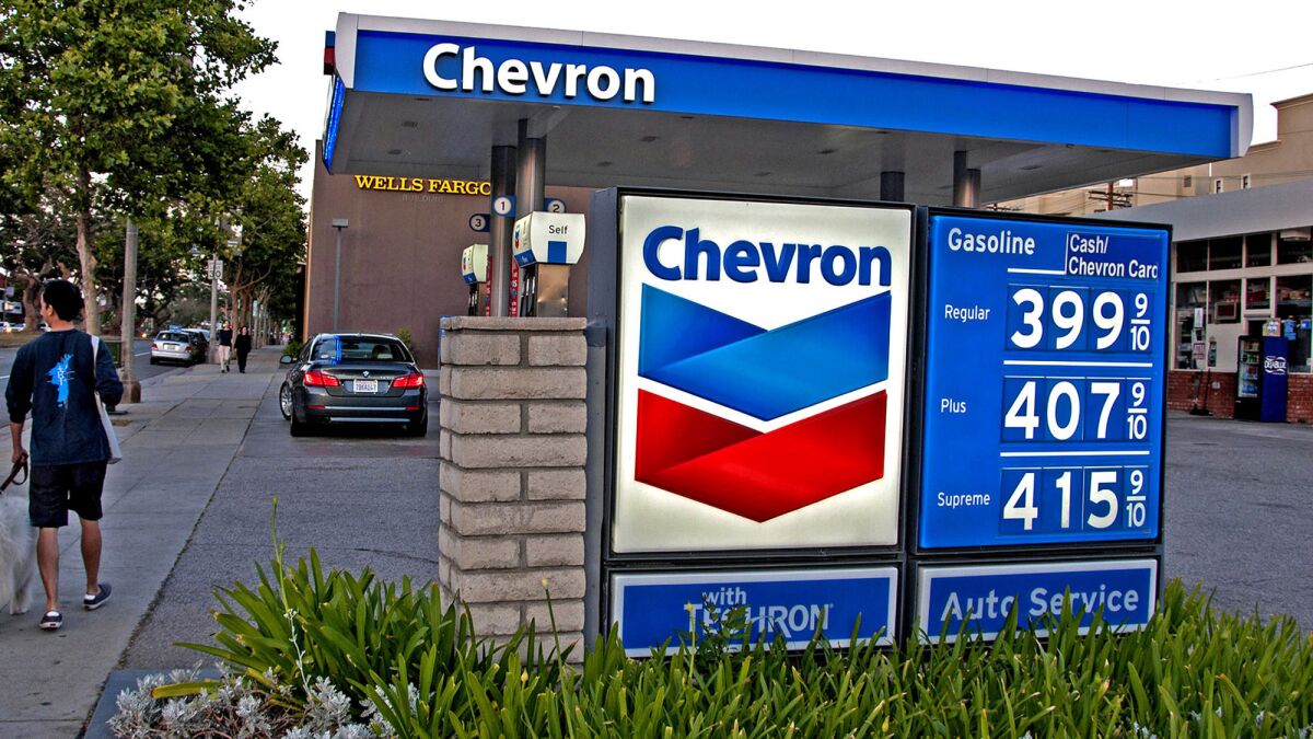 Gas prices are displayed at a Chevron station in Brentwood. The recent surge in regional fuel prices has left local drivers paying more on average than motorists elsewhere in the U.S.