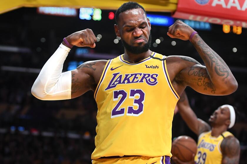 LOS ANGELES, CALIFORNIA JANUARY 7, 2020-Lakers LeBron James celebrates his basket and a foul by the Knicks at the Staples Center Tuesday. (Wally Skalij/Los Angerles Times)