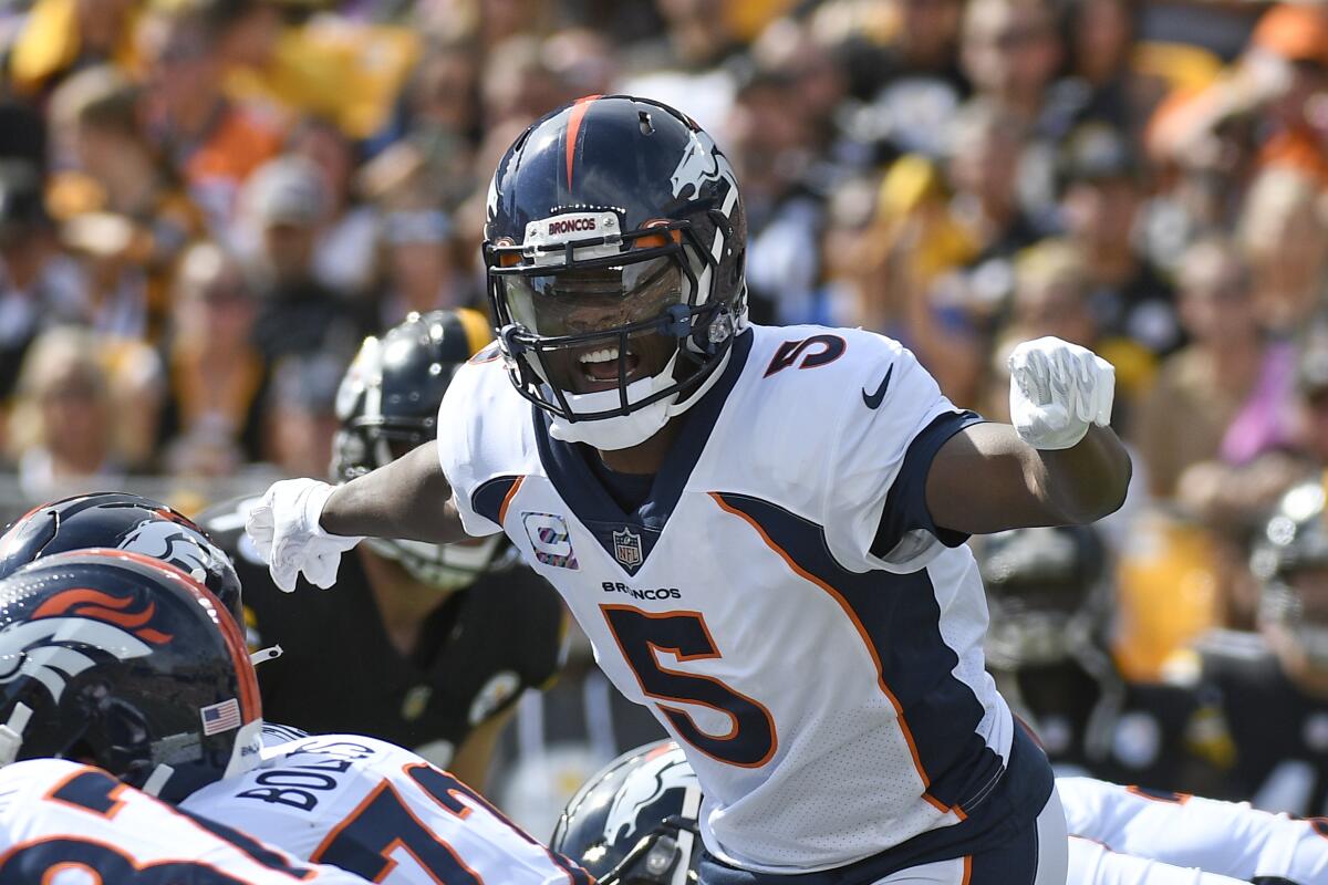 Denver Broncos quarterback Teddy Bridgewater (5) calls signals during the first half of an NFL football game against the Pittsburgh Steelers in Pittsburgh, Sunday, Oct. 10, 2021. (AP Photo/Don Wright)