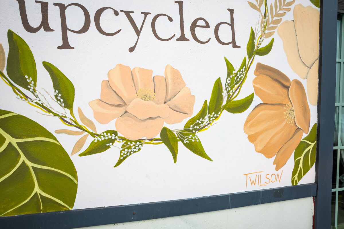 Blooms + Threads’ floral mural is by artist T. Wilson.