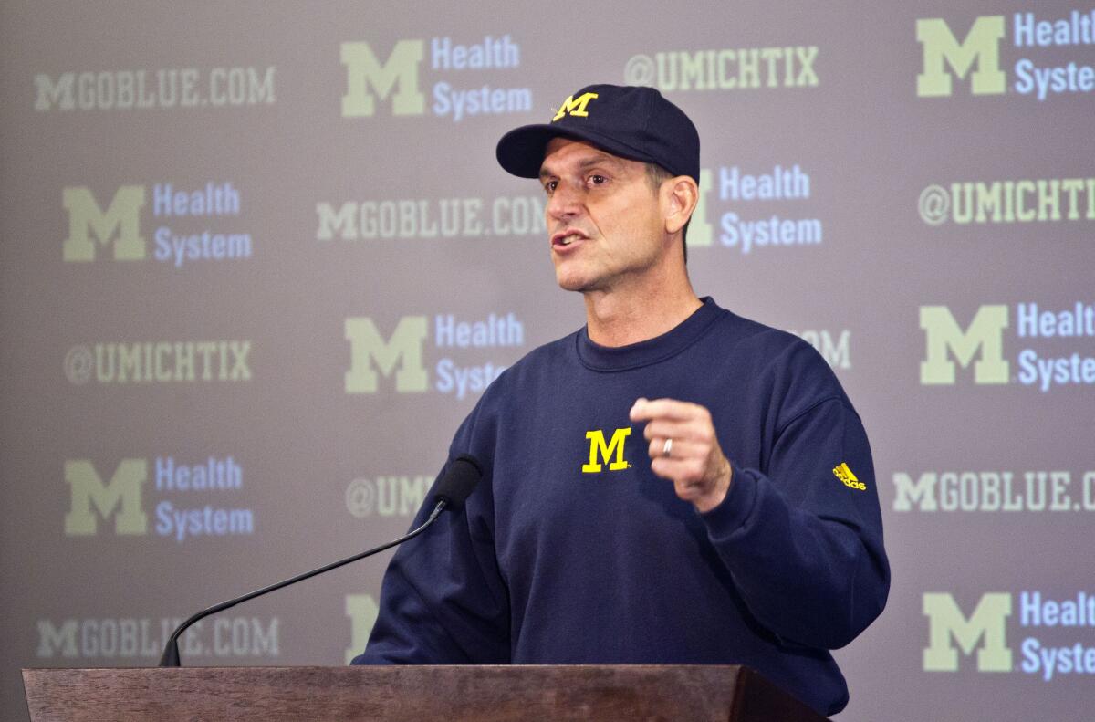 Michigan tabbed former quarterback Jim Harbaugh as the coach to restore the football program to its former glory.