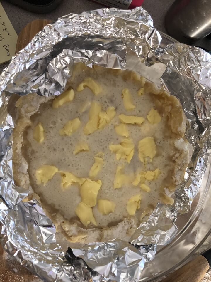 I added foil to the edges of the bowl to create a makeshift pie shield to protect the crust from cooking quicker than the filling
