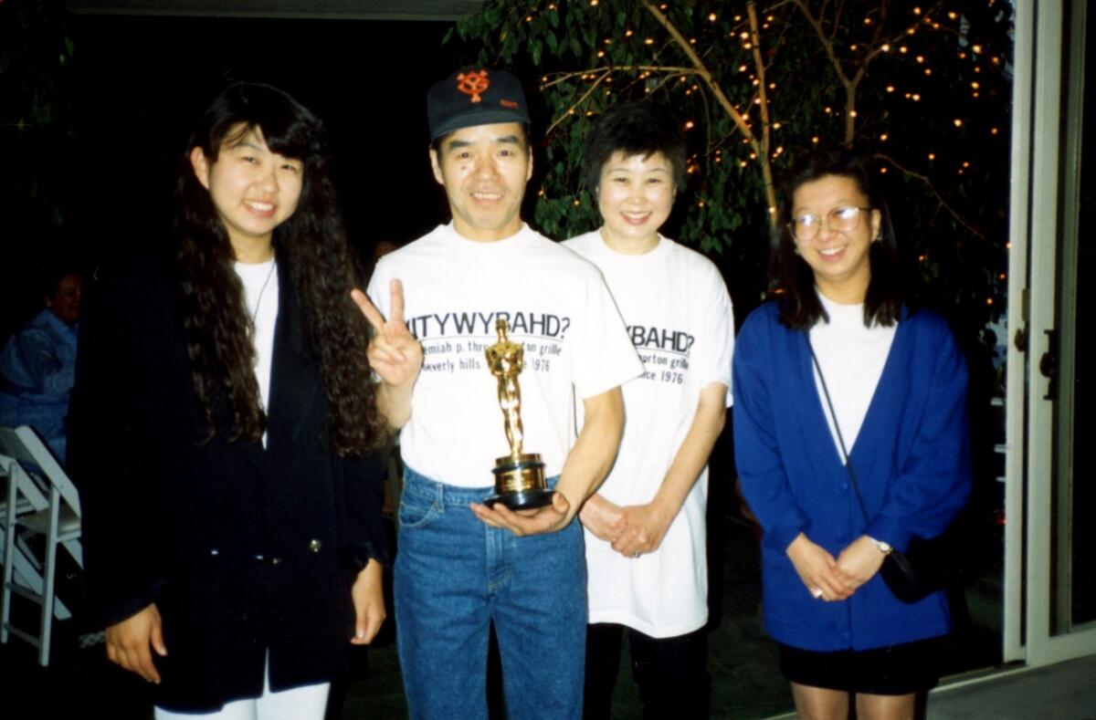 From left, Nori, Sadao, Atsuko and Takako Nagumo posed with an Academy Award.