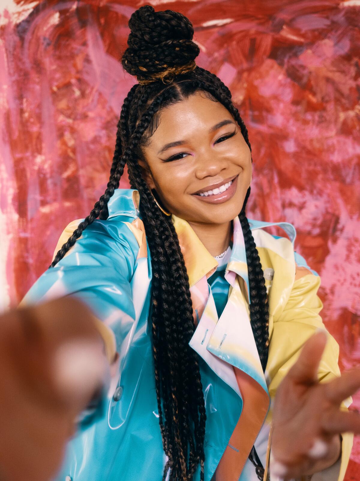  Storm Reid moves her hands toward the camera for a portrait.