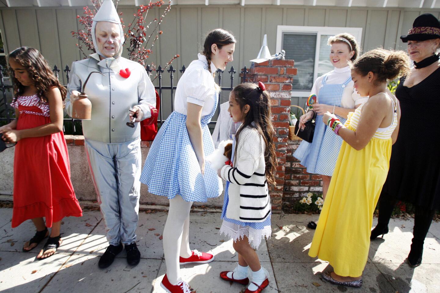 Brenda Lara, 10, from left, Sharon Fane, Montana McCarter, Megan Jimenez, 8, MJ Barnett, Gaby Barnett, 11, and Dorothy Lagrue dress up as characters from the Wizard of Oz during Burbank on Parade, which took place on Olive Ave. between Keystone and Lomita streets in Burbank on Saturday, April 6, 2013.