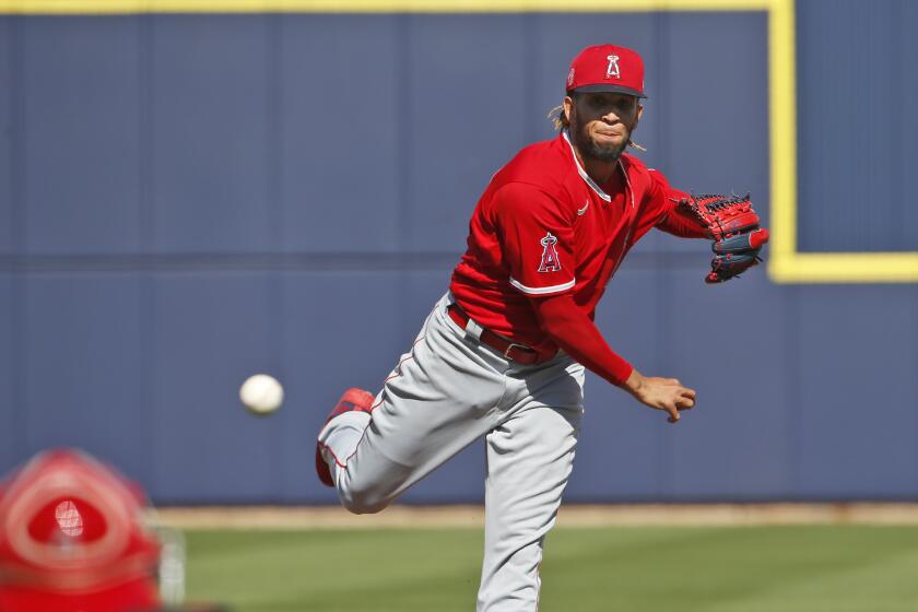 Los Angeles Angels' Keynan Middleton pitches in the fifth Inning of a spring training baseball game against the Milwaukee Brewers, Sunday, March 8, 2020, in Phoenix, Ariz. (AP Photo/Sue Ogrocki)
