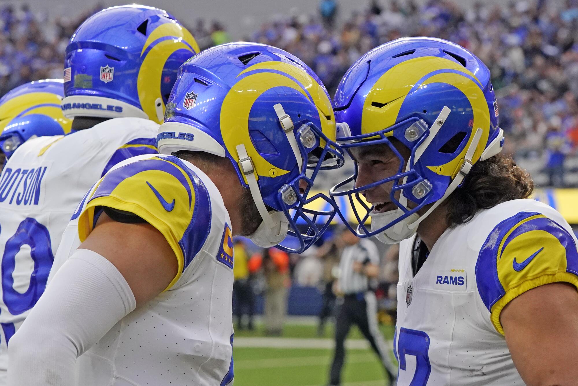 The Rams' Puka Nacua (right) celebrates his touchdown catch with a Matthew Stafford headbutt.