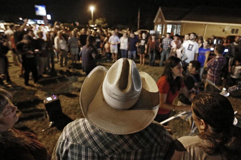 Mandatory Credit: Photo by LARRY W. SMITH/EPA-EFE/REX/Shutterstock (9190245k) People attend a vigil near where a mass shooting took place at the First Baptist Church in Sutherland Springs, Texas, USA, 05 November 2017. According to media reports, a single gunman identified as Devin Patrick Kelley, 26, approached the church and opened fire outside, then entered the church and continued to fire, killing at least 26 people. Kelley was found dead in his vehicle after a brief chase, however the cause of his death is unclear. Mass shooting at baptist church in Sutherland Springs, Texas, USA - 05 Nov 2017 ** Usable by LA, CT and MoD ONLY **