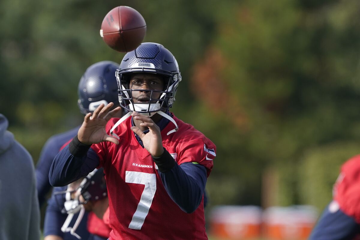 Seattle Seahawks backup quarterback Geno Smith (7) catches a ball during warmups before NFL football practice, Wednesday, Oct. 13, 2021, in Renton, Wash. Starting quarterback Russell Wilson had surgery on his hand last Friday, and Smith is expected to be the starting quarterback Sunday when the Seahawks play the Pittsburgh Steelers on the road. (AP Photo/Ted S. Warren)