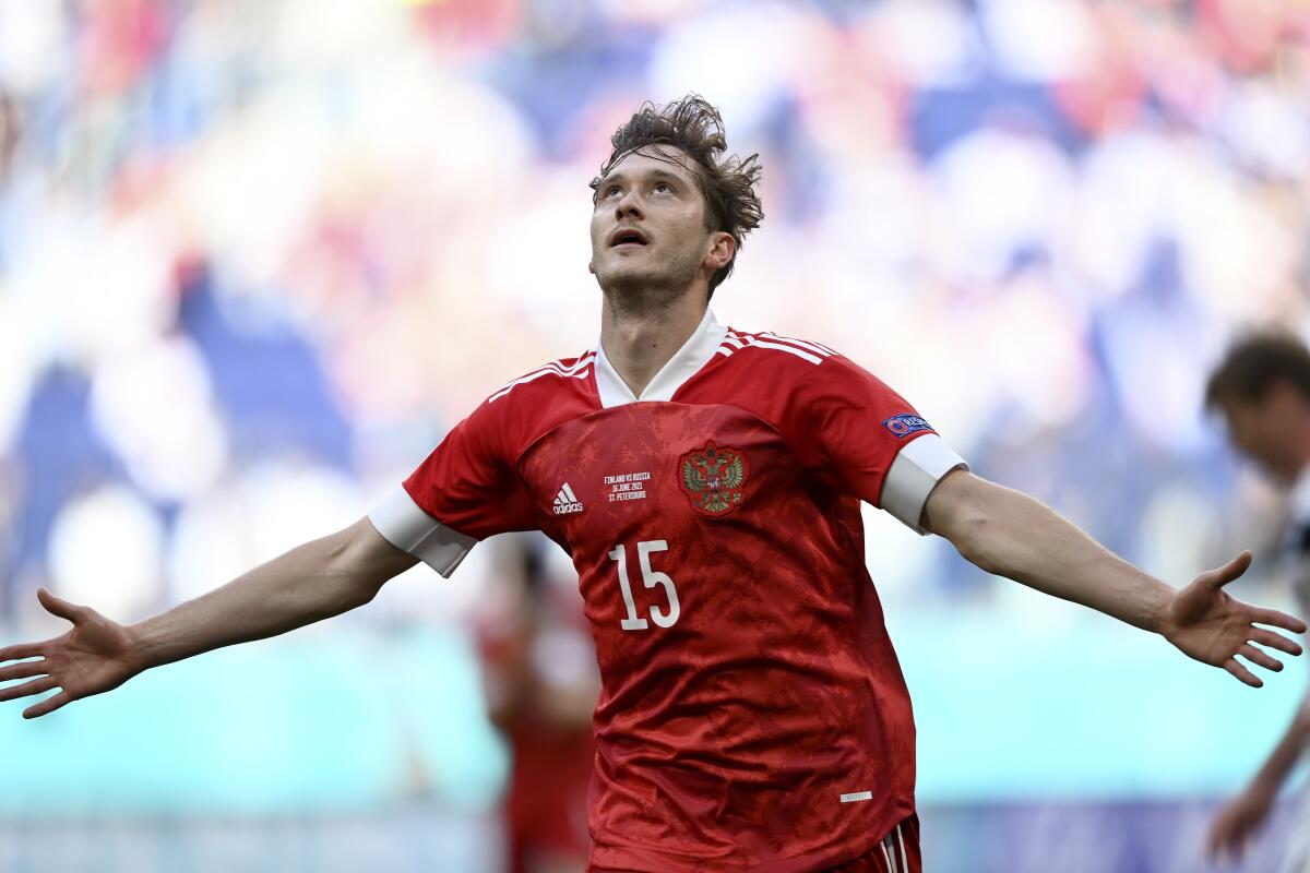Russia's Aleksei Miranchuk celebrates after scoring the opening goal during the Euro 2020 soccer championship group B match between Finland and Russia at the Gazprom Arena stadium in St. Petersburg, Russia, Wednesday, June 16, 2021. (AP Photo/Kirill Kudryavtsev, Pool)