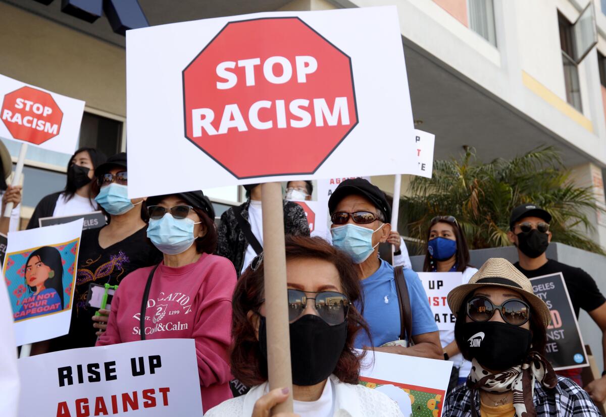 Members of the Thai-American community participate in a rally against Asian hate crimes in Thai Town in Los Angeles.