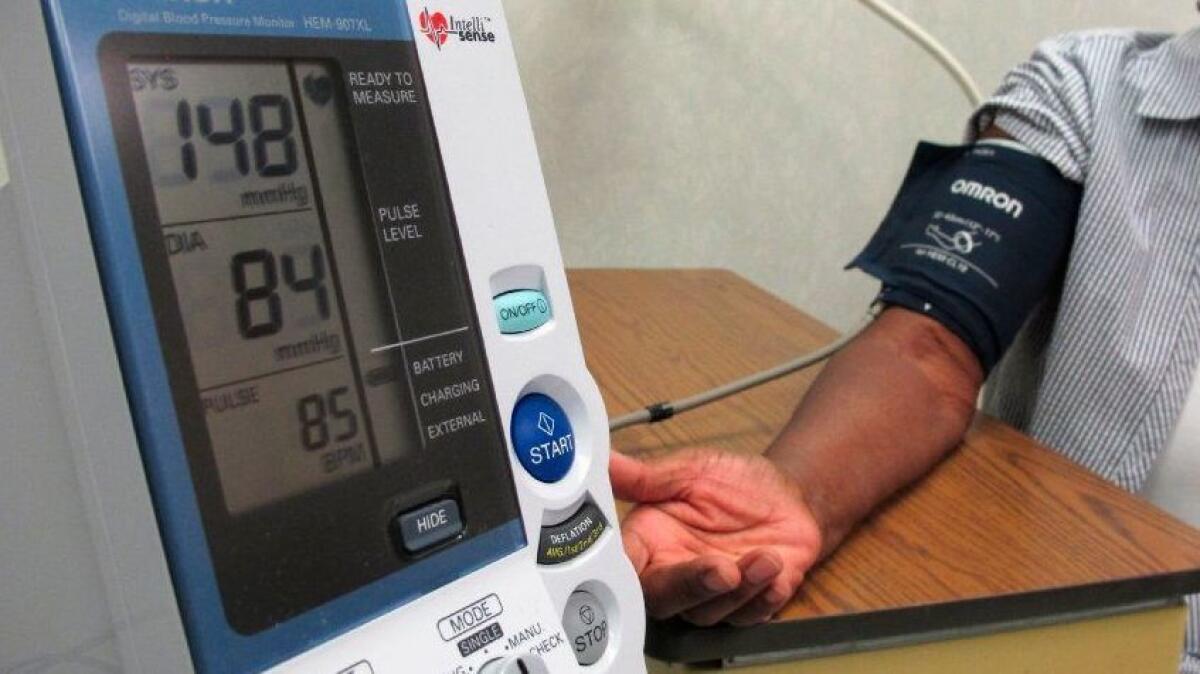 A woman has her blood pressure checking at the Wake Forest Baptist Medical Center in Winston-Salem, N.C., in July.