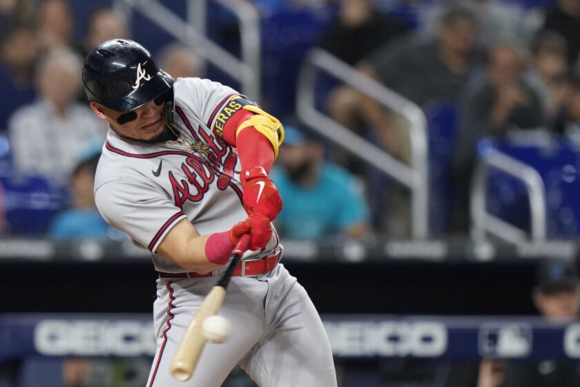 Atlanta Braves' William Contreras gets a base hit during the fourth inning of a baseball game against the Miami Marlins, Tuesday, Oct. 4, 2022, in Miami. (AP Photo/Wilfredo Lee)
