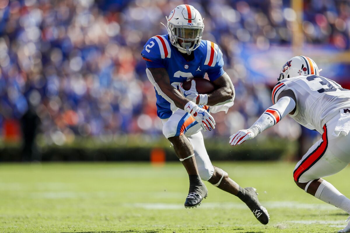 Florida's Lamical Perine runs for yardage during the second quarter against Auburn on Saturday in Gainesville, Fla.