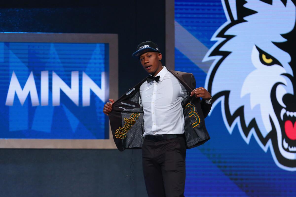 Kris Dunn walks on stage after being drafted fifth overall by the Timberwolves in the 2016 NBA draft.