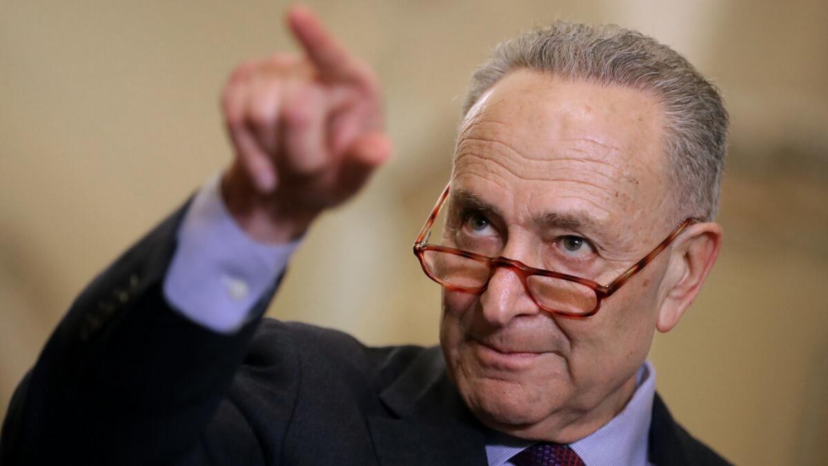 Senate Minority Leader Chuck Schumer (D-NY) talks to reporters following the weekly Democratic Senate policy luncheon in Washington on March 5.