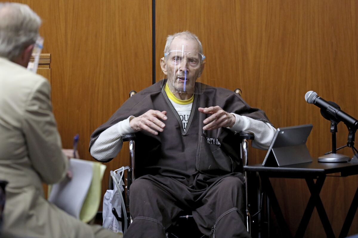 New York real estate scion Robert Durst, 78, answers questions from defense attorney Dick DeGuerin, left, while testifying in his murder trial at the Inglewood Courthouse on Monday, Aug. 9, 2021, in Inglewood, Calif. Durst is charged with the 2000 murder of Susan Berman inside her Benedict Canyon home. He testified Monday that he did not kill his best friend Berman. (Gary Coronado / Los Angeles Times via AP, Pool)