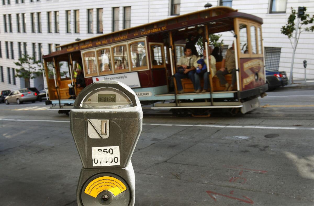 A cable car passes a parking meter near San Francisco's financial district in October 2009.