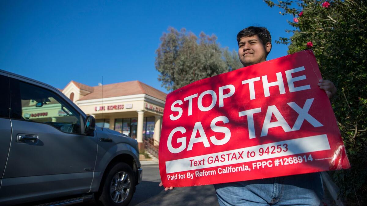 David Guerrera urges motorists in Corona to sign a petition for a proposed ballot measure to repeal the increase in California's gas tax.
