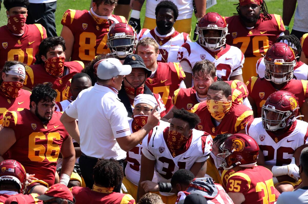 USC coach Clay Helton speaks to players at the end of USC's spring football game on Saturday.