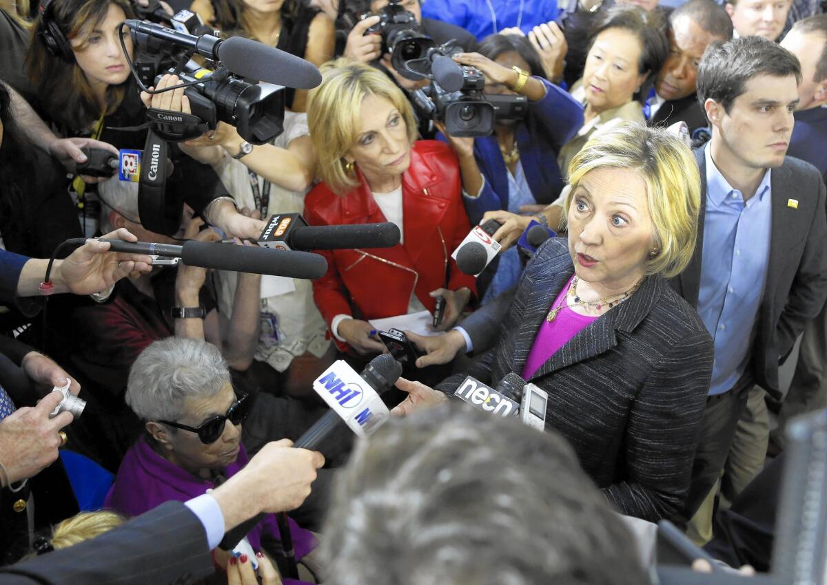 Hillary Rodham Clinto speaks to reporters after a roundtable discussion in Hampton, N.H.