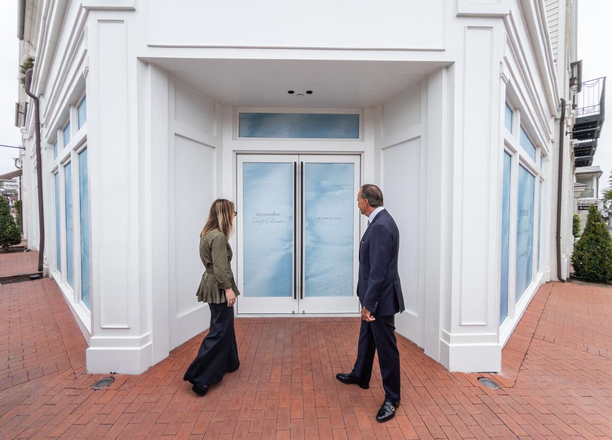 Elyse Walker and Rick Caruso are strolling at her new flagship store in Palisades Village, which will reopen in 2026.