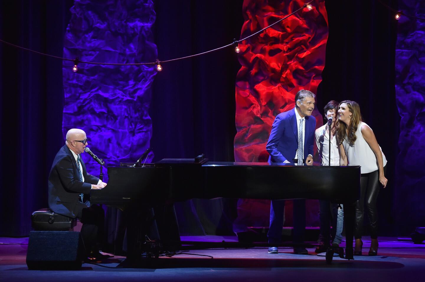 From left, Paul Shaffer, Fred Willard, Tig Notaro and Heather McDonald perform "It's Raining Men" to close out the event, which raised $600,000 for the International Myeloma Foundation.