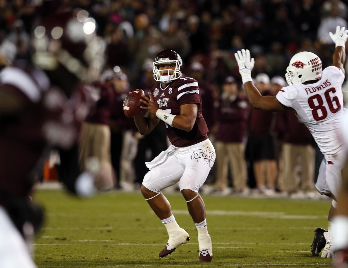 Mississippi State quarterback Dak Prescott threw for a career-high 331 yards with a touchdown to go with 61 yards rushing in the Bulldogs' 17-10 victory over Arkansas.