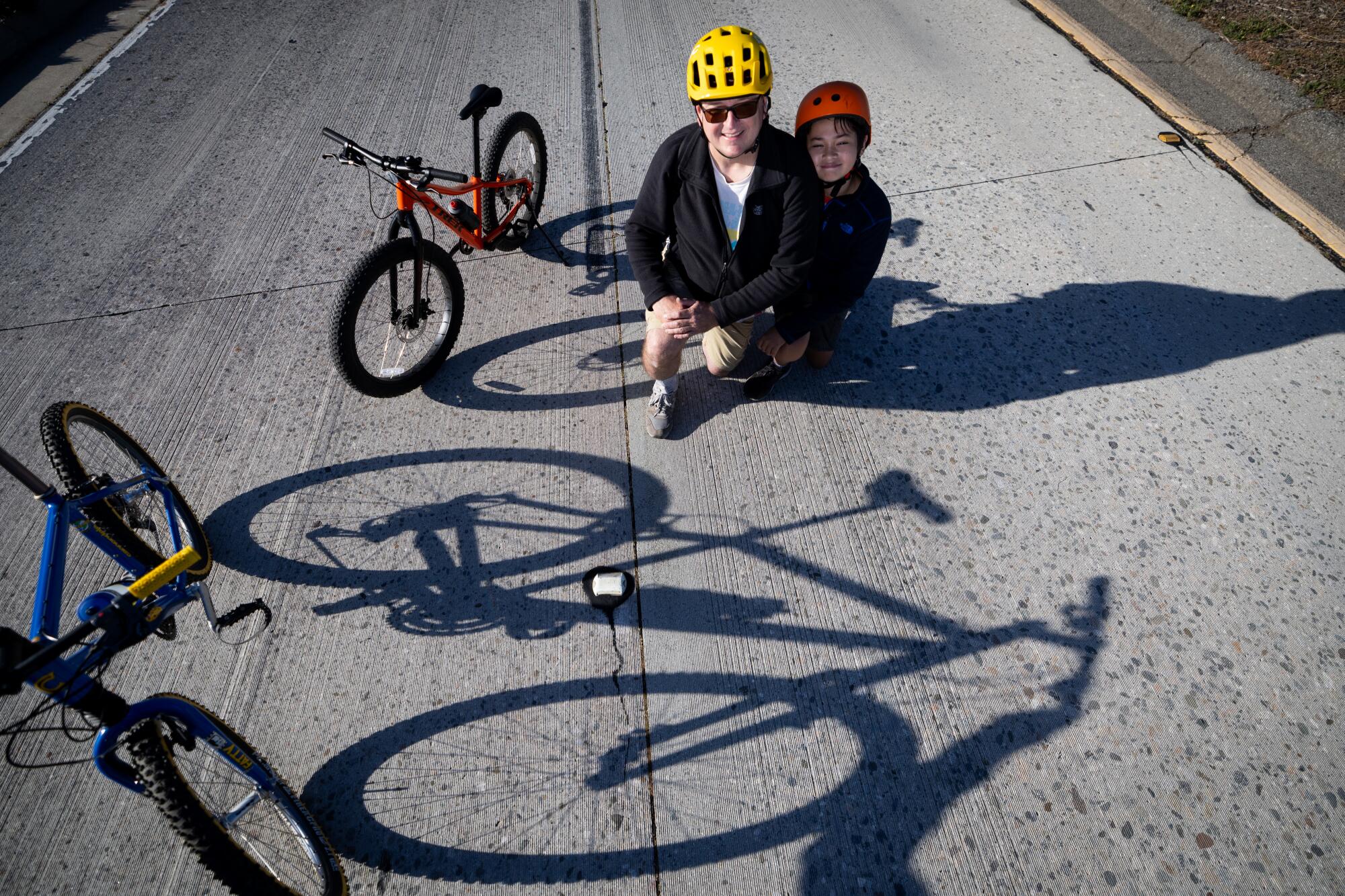 John Engelke and son Liam, 12, of Silver Lake pose on the 110 Freeway