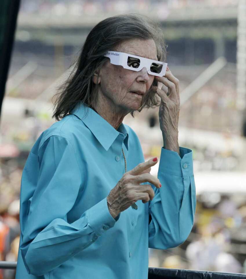 Mari Hulman George, chairman of the board at Indianapolis Motor Speedway and the race's starter on Sunday, sports the Wheldon white sunglasses.