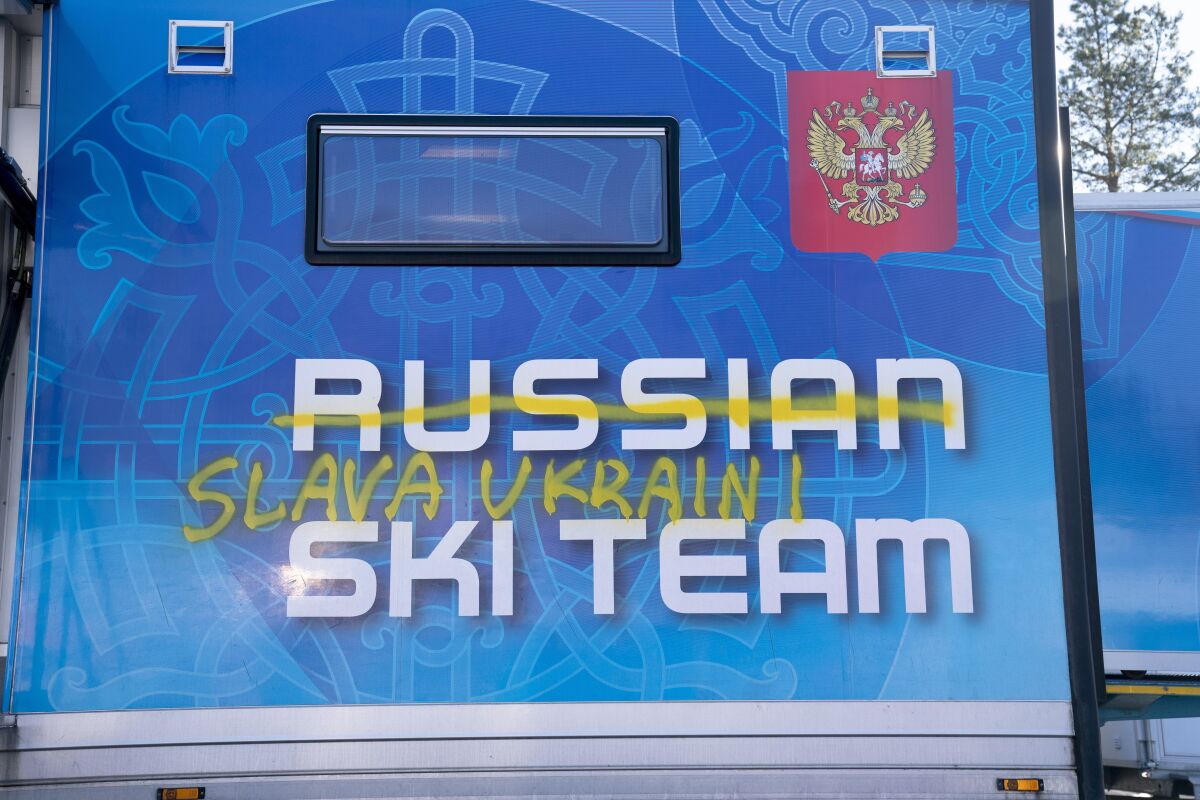 Writing reading "Glory to Ukraine" is seen on the side of the trailer of the Russian cross-country national team, in Holmenkollen. near Oslo, Wednesday, March 2, 2022. In Norway, Russian cross-country skiers, who won 11 medals at the Beijing Olympics, were heading home after being excluded from competition by the International Ski Federation, known as FIS. The decision came after a three-day standoff with Norwegian ski officials, who said they would refuse to let Russians and Belarusians race if FIS maintained its previous policy of allowing them to compete as neutral athletes. (Torstein Boee/NTB scanpix via AP)