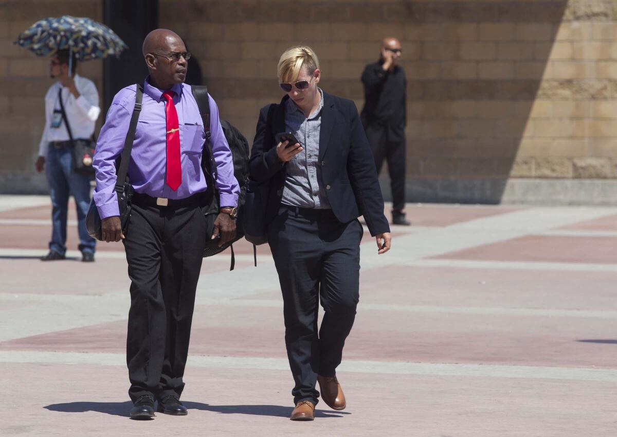 Roman Sabal, left, and his Attorney Victoria Starrett, walked back in to Mexico after being turned away from the border at the PedWest port of entry on July 15, 2019. Sabal was scheduled to have a citizenship interview but was denied entry to attend the proceeding.