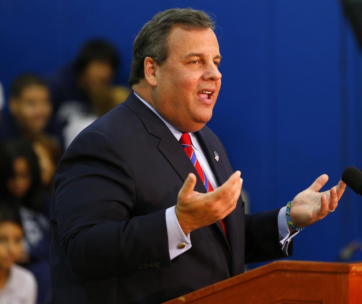 New Jersey Gov. Chris Christie talks to the media as he visits Jose Marti Freshman Academy in Union City, N.J.